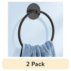 two pack of towel rings on the wall, with one ring hanging from it's side