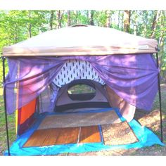 a tent that is in the middle of some trees