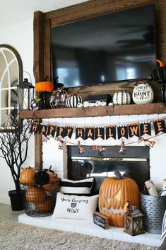 a fireplace decorated for halloween with pumpkins and decorations