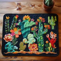 a potted plant sitting on top of a wooden table next to a cactus rug