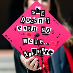 a pink graduation cap with the words she doesn't even go here anymore