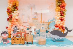 an ocean themed birthday party with balloons and decorations