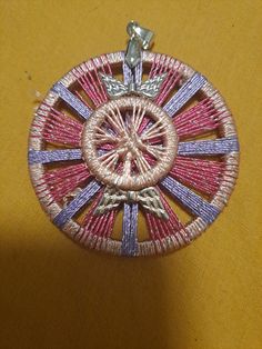 a brooch that is sitting on a table