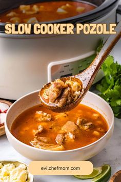 slow cooker pozole soup in a white bowl with a ladle scooping out