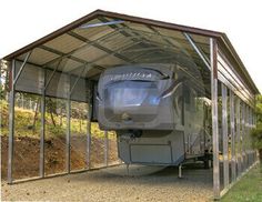 an rv is parked under a metal carport