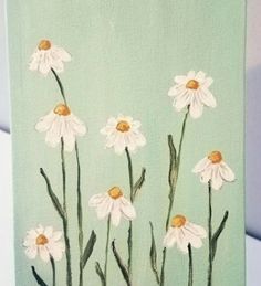 a painting of white daisies on a green background