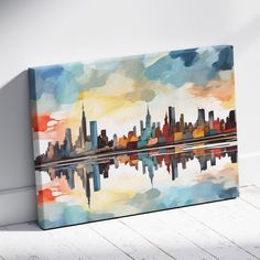 an abstract painting of a cityscape with water reflecting it's skyline in the foreground