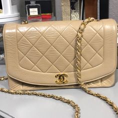 Vintage Authentic Chanel Diana Bag Beige With Gold Strap Lambskin Leather (See Photos For Leather Condition) Bottom: Great Condition Interior: Great Condition (No Staining) Kept In Sleeper Bag, No Authenticity Card But Poshmark Will Authenticate. Keep In Mind This Bag Is Vintage And At Least 30 Years Old. Chanel Diana Bag, Vintage Chanel Bag, Bags Vintage, Chanel Purse, 30 Years Old, Chanel Bags, Vintage Chanel, Lambskin Leather, Chanel Bag