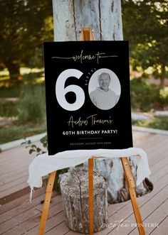 an easel with a sign that says welcome to the 60th birthday party