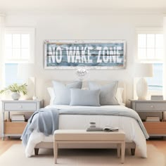 a bedroom with a bed, nightstands and two windows that have the words no wake zone painted on them