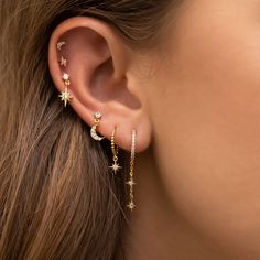 Let the skies shower upon you every day! 18k gold plated, 18k rose gold plated, or rhodium plated over brass with a protective coating Cubic zirconia stones Sterling silver posts 12mm hoop diameter, 21mm dangle length Ušný Piercing, Bloom Jewelry, Minimalist Ear Piercings, Cool Ear Piercings, Pretty Ear Piercings, Cute Ear Piercings, Smink Inspiration, Moon And Star Earrings, Stacked Earrings