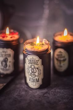 three candles sitting next to each other on a table