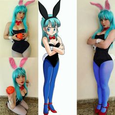 a woman with blue hair wearing bunny ears and holding an orange in her hand while standing next to a wall