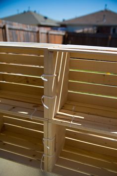 a wooden bench sitting on top of a patio