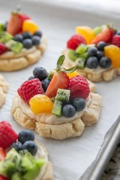 fruit and cream cookies on a baking sheet