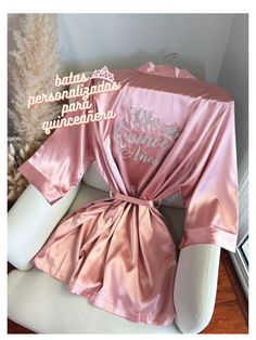 Get ready for your Mis Quince Años celebration in style with our Quinceañera Satin Robes!  Crafted from soft and silky high-quality satin, these robes are designed to make you feel like a princess on your special day. With different options for text color and designs on the back side, you can customize your robe to match your unique style and personality. Not only are these robes perfect for getting ready, but they're also ideal for Instagram and Pinterest photos. Order yours Mis Quince robe tod Rhinestone Tiara, Silk Robe, Custom Glitter, Pinterest Photos, Quince, Womens Robes, Sweet Sixteen, Dusty Pink, Quinceanera