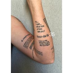 a man's arm with words written on it