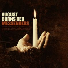 a person holding a candle in their hand with the words august burns red messengerers on it