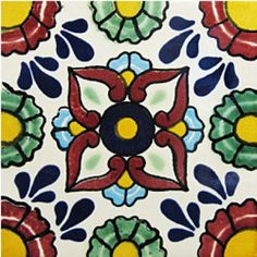 an artistic tile design with flowers and leaves