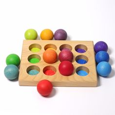 an assortment of colorful wooden toys on a white background