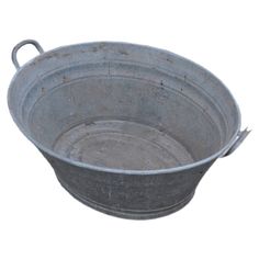 an old metal bowl with handles is shown on a white background for use as a serving dish