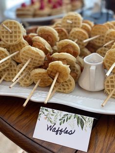 some waffles are on a plate with toothpicks