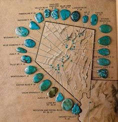 an old book with turquoise colored rocks and arrows pointing to the names of each stone