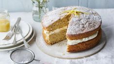 there is a cake on the table with two slices cut out and ready to be eaten