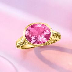 Ross-Simons - 6.30 Carat Pink Topaz Ring in 18kt Gold Over Sterling. Size 8. This sweet cocktail ring is sure to make you blush. In polished 18kt yellow gold over sterling silver, a 6.30 carat pink topaz oval is the perfect pop atop a fashionable rope shank! 3/8" wide. Pink topaz ring. Fine Jewelry Yellow Gold Solitaire Topaz Ring, Fine Jewelry Yellow Gold Topaz Ring, 14k Yellow Gold Topaz Ring With Vs Clarity, Yellow Gold Sterling Silver Topaz Ring, Fine Jewelry Yellow Gold Topaz Ring In Sterling Silver, Sweet Cocktail, Pink Topaz Ring, Sweet Cocktails, Turquoise Drop Earrings