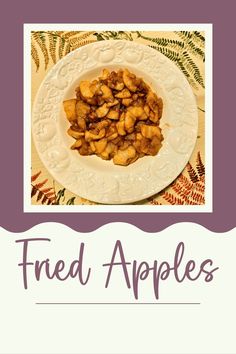 a white plate topped with fried apples on top of a tablecloth covered table cloth