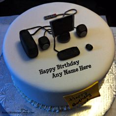 a birthday cake with an electronic device on it