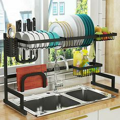 the dish rack is full of dishes in the kitchen