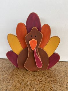 a wooden turkey is sitting on the counter