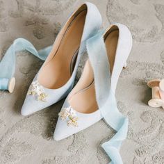 Step into elegance with these chic light blue vegan suede floral pointy toe bridal heels. The floral decor adds a touch of sophistication, making them perfect for various occasions. Color: Lightblue Material: Vegan suede Heel Type: Stiletto heel Heel Height: 4'' / 100 mm approx Product measurements were taken using size 8. Please note that measurements may vary by size. Toe: Pointed toe Floral decoration design Handcrafted US sizing. Fits true to size. Light Blue Wedding Shoes, Blue Bridal Heels, Blue Heels Wedding, Bridal Ballet Flats, White Heels Wedding, Blue Bridal Shoes, Bride Heels, Wedding Shoes Low Heel, Blue Wedding Shoes