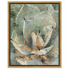 an abstract painting with gold and green leaves