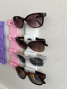 Introducing our innovative Sunglasses Holder - the ultimate solution for organizing and storing your sunglasses, eye glasses, and safety glasses. Say goodbye to clutter and hello to a tidy and efficient space! Designed to be attached to any wall or door, this Sunglasses Holder is a versatile accessory that will transform the way you store and access your eyewear. This holder offers convenience and functionality like no other. One of the standout features of our Sunglasses Holder is its ability t Lego Glasses Holder, Sunglasses Display Ideas, Glasses Storage Ideas, Sunglasses Display, Sunglasses Holder, Script Writing, Safety Glasses, Sunglass Holder, Eyeglass Holder