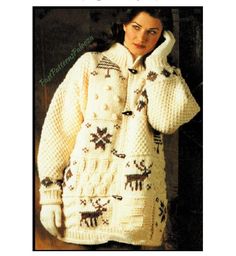 a woman is wearing a sweater with deers on it and holding her head to her ear