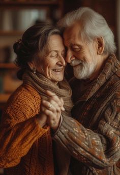 an older man and woman embracing each other