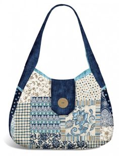 a blue and white purse with patchwork on the front, pocketed inside it