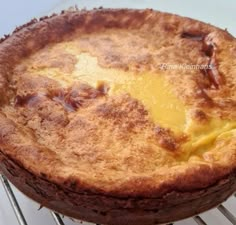 a baked pie sitting on top of a cooling rack