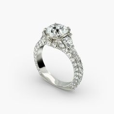 a diamond engagement ring with an oval center surrounded by pave set diamonds on the sides