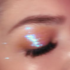 a woman's eye with bright light shining on it