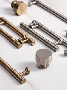 several different types of handles and knobs on a white surface