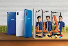 three samsung smartphones with images of two men and one woman in front of them