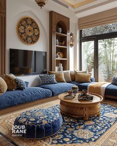 a living room filled with furniture and a flat screen tv mounted on a wall above a wooden coffee table