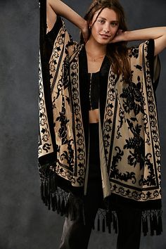 This luxe sheer kimono features a stunning velvet floral print design and fringe hem. **Fit:** Relaxed and oversized **Features:** Open-front design, armholes, side slits, sheer fabrication, velvet floral print, fringe hem **Why We | Nightbird Burnout Kimono by Free People in Black Velvet Fringe Kimono, Velvet Fringe, Maxi Kaftan, Sheer Kimono, Fringe Kimono, Floral Print Design, Bohemian Beach