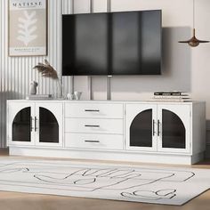 This high-end minimalist TV stand embodies a sleek yet functional design, perfect for enhancing the aesthetics and organization of any contemporary living space. With its spacious top, ample storage options, adjustable shelving, and elegant design elements such as the arched glass doors and sturdy wood base, it offers a premium storage solution that enhances any modern living room. It is a practical and stylish addition to your home that elevates your living space. Color: White. Arched Glass Doors, Minimalist Tv Stand, Shelves For Living Room, White Tv Stands, Tv Stand Console, Tv Stand With Storage, Console Cabinet, Tv Stands And Entertainment Centers, Glass Cabinet Doors