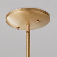 a close up of a light fixture on a gray background