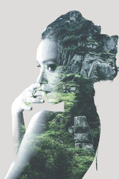 a woman's face with trees and rocks in the background