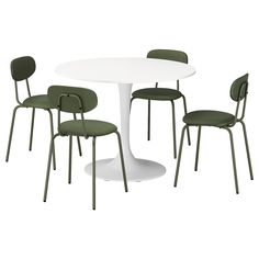 a white table with four green chairs around it